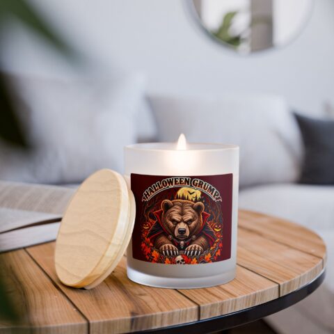Halloween Grump Candle lit on a side table, lid off